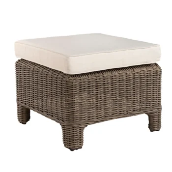 The Layton Ottoman is a small square footstool with classic Artwood vintage weave. A square off-white cushion sits on top