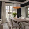 A dining setting in a stylish house showing the Artwood Mandy Dining Chair in Sway Natural fabric around a light coloured wooden dining table.