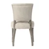 Back view of an Artwood Mandy Dining chair upholstered in Sway Natural with Pearl Grey wooden legs.