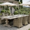 A beautiful outdoor dining setting with an Artwood outdoor teak rectangle dining table. Around the table is six orlando outdoor dining chairs in a vintage colour wicker.