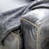 Close up of Halo Buddy Armchair leather colour and detail.