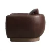 Side image of the Halo Cuppa Swivel Armchair in bull cigar leather with a wooden base in brushed smoke.